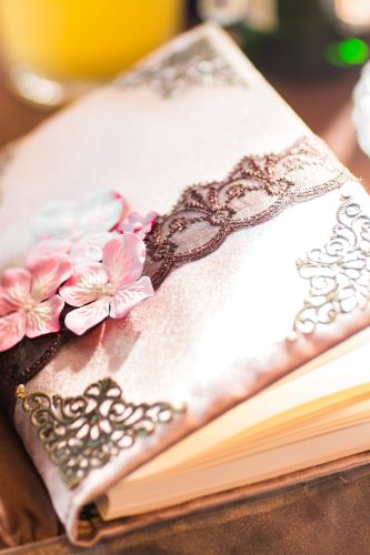 wedding wish book decorated with flowers and lace.